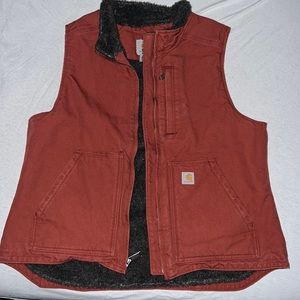 Barely worn Carhartt vest. Harder to find burnt orange color.